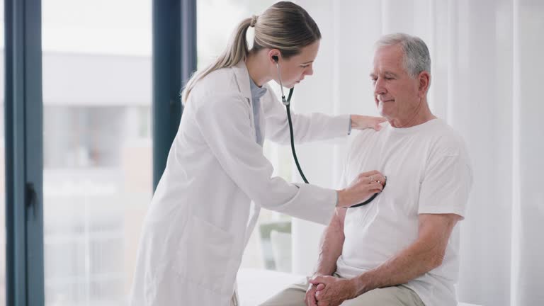 Doctor checking patient's heart